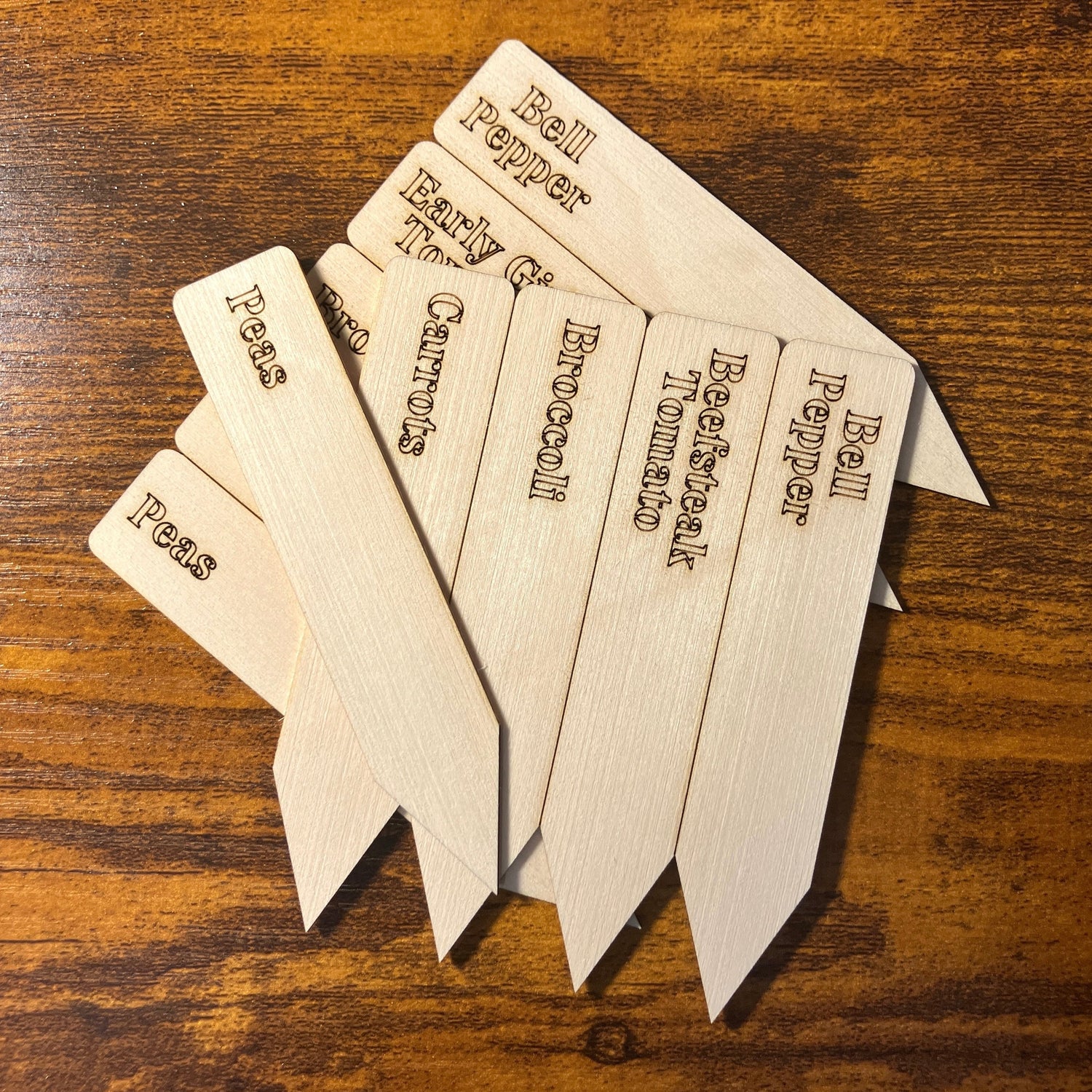 Personalized vegetable plant garden markers arrive in sheets of 10 for you to break off and mark your variety location in your garden or starter pots.